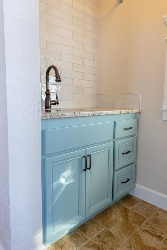 Eugene Painter paints laundry room sink with Benjamin Moore