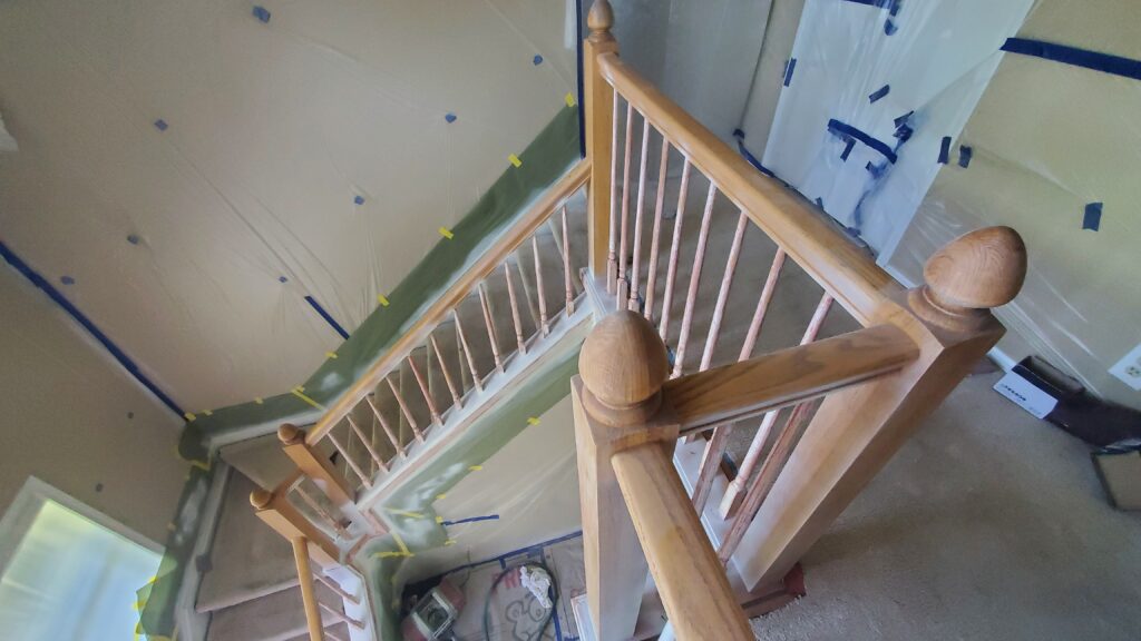 Eugene Painter prepares Stairway for Painting by first sanding  