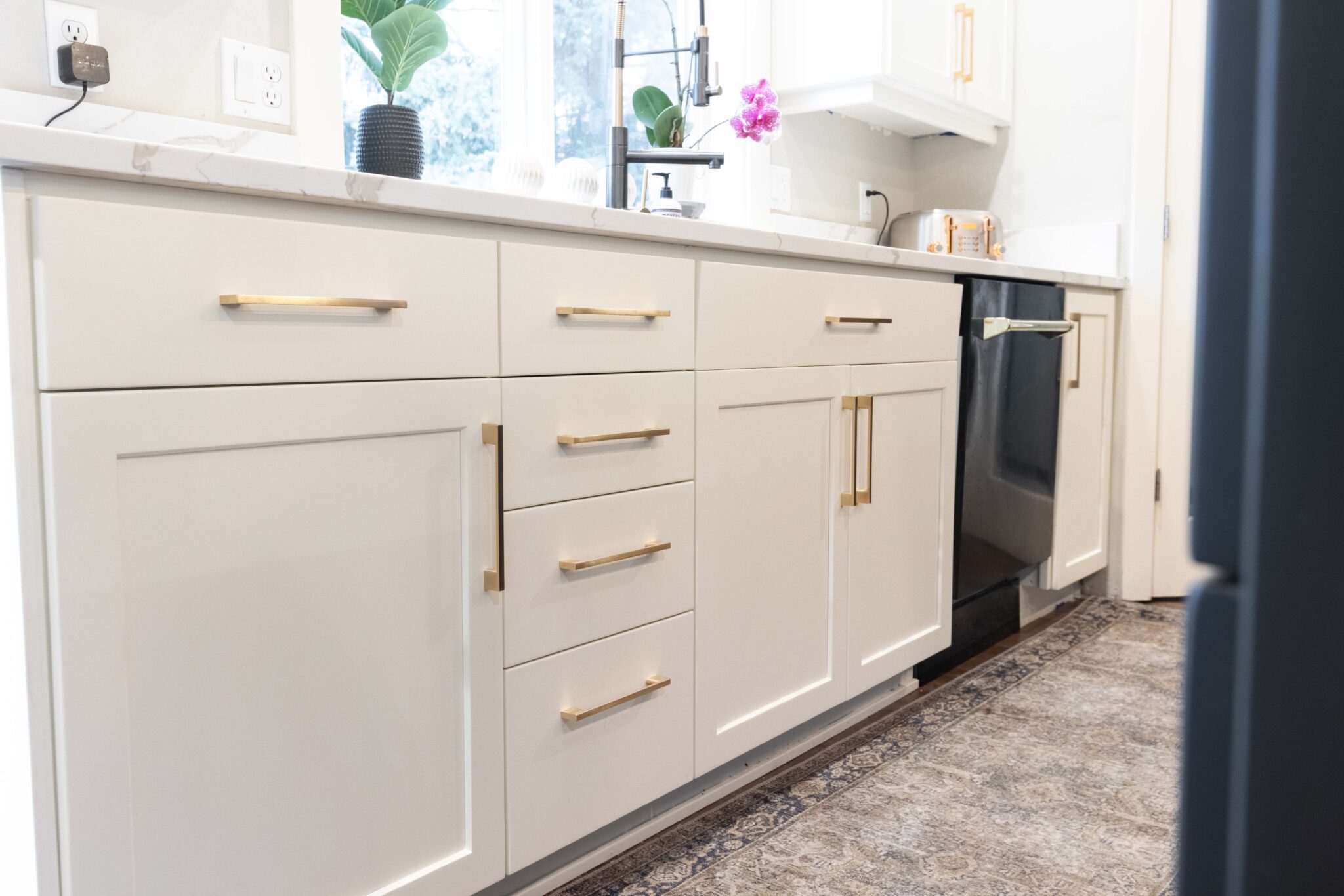 Kitchen cabinets painted in off white satin sheen