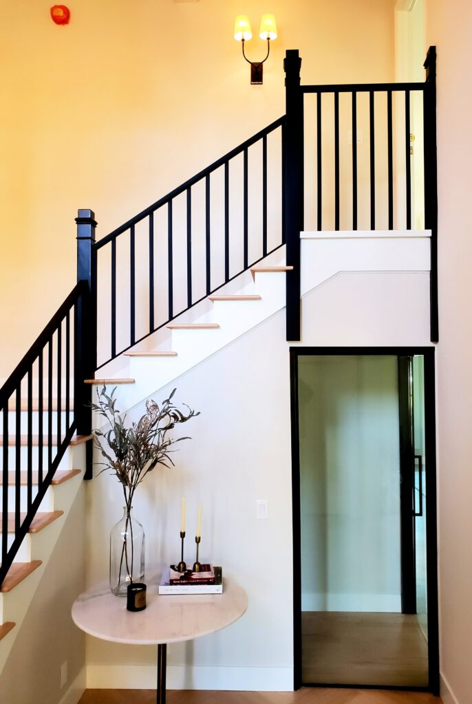 Eugene House Painter with Staircase staging at entrance